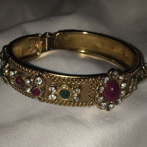 066 Gold metal clip bracelet with purple green stones
